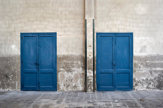 Closed blue doors in abandoned factory