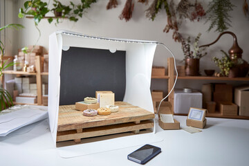 Soaps arranged in lightbox on table at workshop