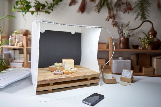 Soaps arranged in lightbox on table at workshop