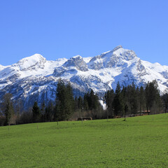 Fototapeta na wymiar Snow covered mountain range in the Saanenland Valley.
