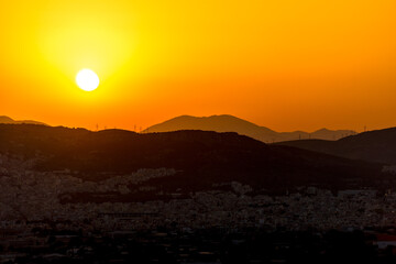 Beautiful sunset colors over the mountains Athens, Greece