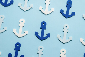 Blue anchors on a blue background.