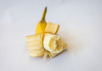 bitten banana on a white background. appetizing banana