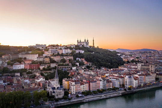 France, Auvergne-Rhone-Alpes, Lyon, Aerial view of riverside city at dusk