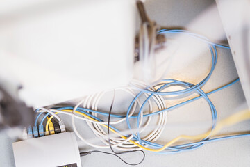 Tangled cable wires with device on table