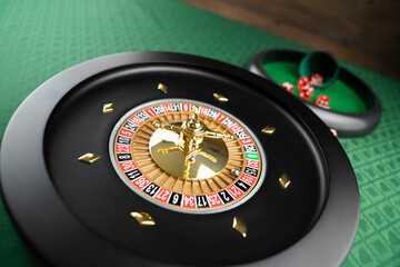 Casino theme.  Roulette wheel on green table.