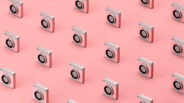 Three dimensional pattern of old-fashioned camera standing in rows against pink background