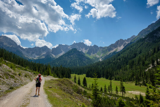 Hiker looking Karwendel mountains view while standing on footpath at Tyrol, Austria