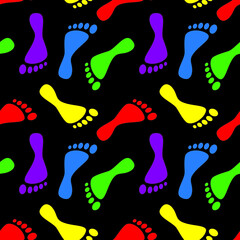 Colorful human footprints silhouette paths on black background. Clip-art vector illustration. Seamless pattern.