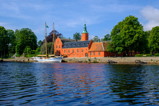 Sweden, Halland County, Halmstad, HSwMS Najaden moored in front of Halmstad Castle