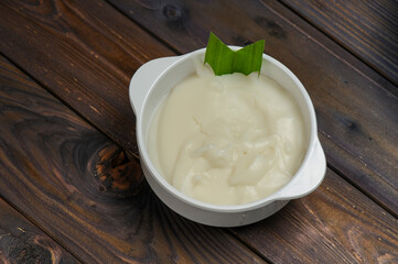 Bubur Sumsum or Javanese dessert porridge of rice flour, coconut milk with palm sugar 