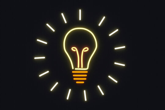 Illuminated light bulb on black wall