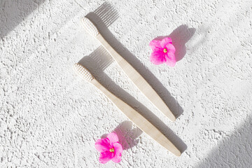 Bamboo brushes on a white background copy space. Concern for the environment. Toothbrush. Dental health. Copy space .