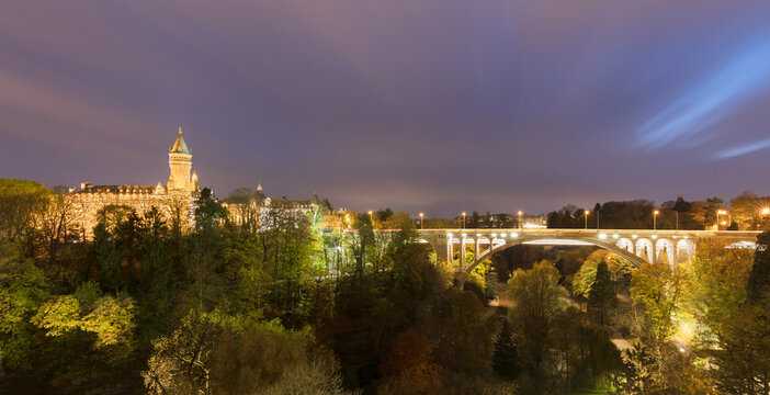 Adolphe Bridge by Musee de la Banque over Parcs de la Petrusse against sky, Luxembourg City, Luxembourg