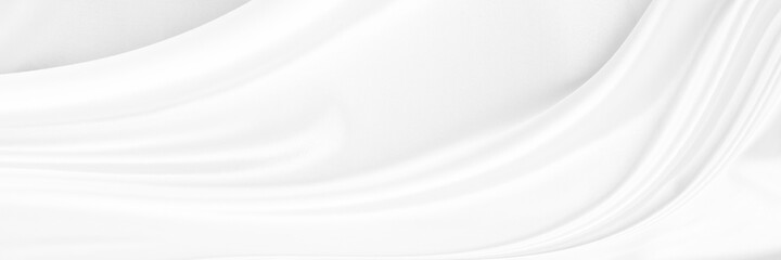 White gray satin texture that is white silver fabric silk panorama background with beautiful soft blur pattern natural.