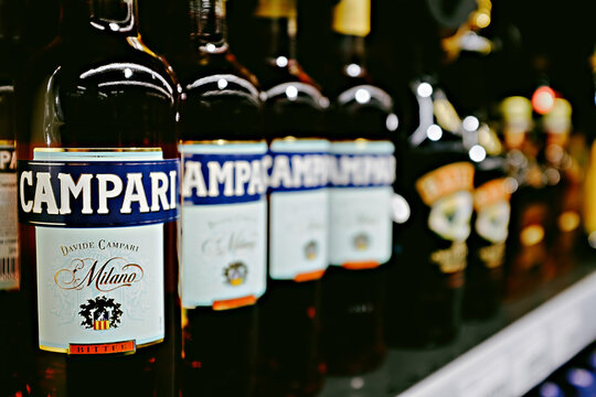 editorial selective focus photo of Campari bottles - an italian alcoholic liqueur