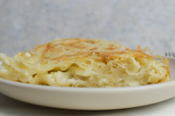 Traditional Balkan, Serbian burek, borek, cheese pie, phyllo dough,  on the white plate, close up