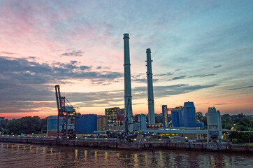 Fototapeta na wymiar Industrial landscape at the sunset on the River Elbe - Hamburg