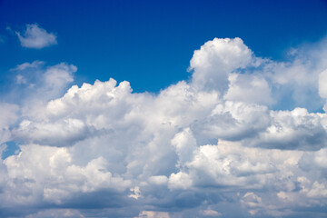 Fototapeta na wymiar White clouds in blue sky, summer sunny day