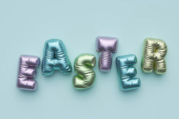 Three dimensional render of pastel colored balloons arranged into single word