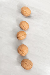 Group of walnuts on a concrete background
