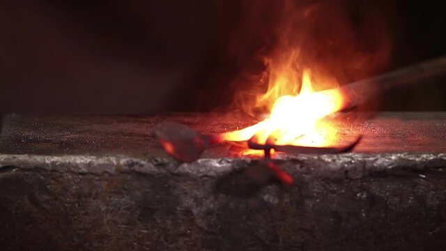 forge welding decorative iron on the anvil