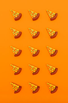 Three dimensional render of pizza slices on orange background