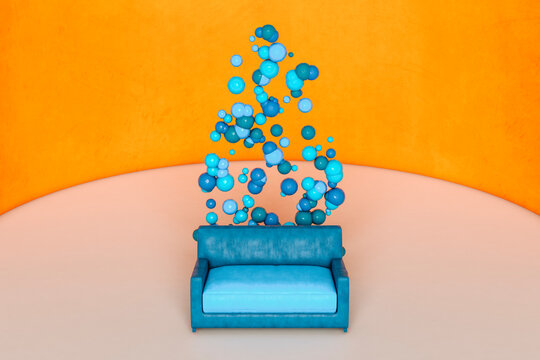 Blue sofa and spheres against orange wall