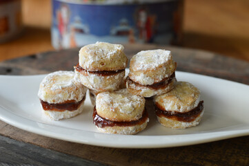 Traditional Serbian homemade sugar powered vanilla cookies with jam (vanilice) round and star shape
