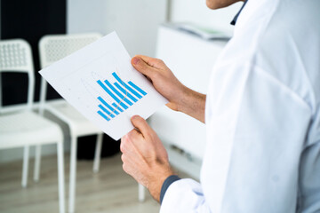 Scientist analyzing reports in laboratory