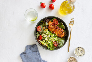 Salad with chicken, avocado and tomatoes. Healthy eating. Vegetarian food.