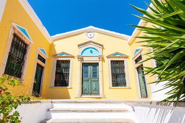 Fototapeta na wymiar Old yellow house in Symi town, Dodecanese islands, Greece