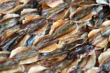 Dried Sweet Fish one of the dried seafood dishes, lined on a tray and blurred the background.