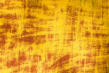 Abstract paint texture. Yellow lines on a red background.