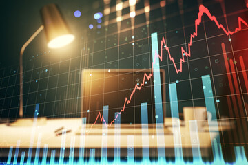 Multi exposure of abstract financial graph on laptop background, financial and trading concept
