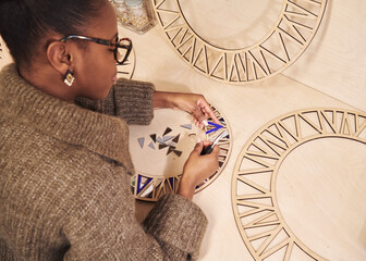 person making a mirror by hand
