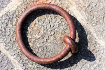 Close up of rusty mooring loop on pier