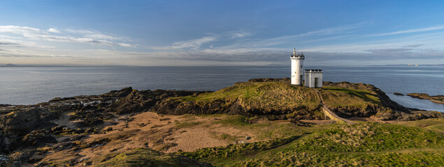 lighthouse on the shore of the sea