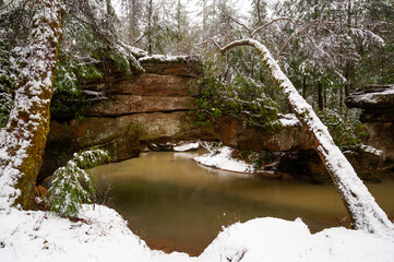 Rock Bridge Surrounded by Snow - Sandstone Arch Over Water - Red River Gorge Geological Area - Glady, Kentucky - 432003518