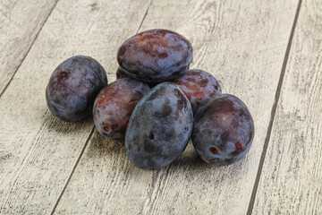 Purple sweet ripe plum heap