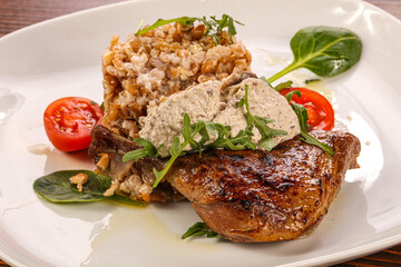 Roasted duck leg with mushrooms