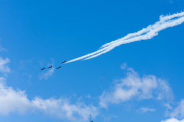 Four aeroplanes flying in formation with smoke trails in New Zealand