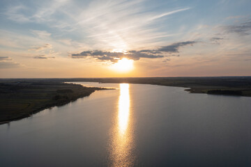 Fototapeta na wymiar Aerial view of a still lake at sunset