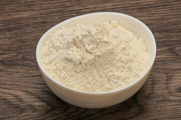 Wheat flour heap in the bowl