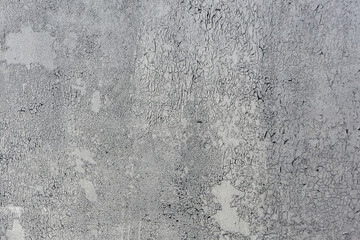 Obraz premium Texture of a wall made of rough metal painted with gray cracked paint