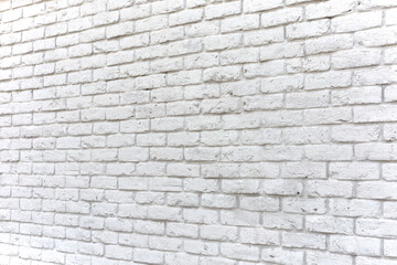 Wall texture of damaged pure white brick, perspective view