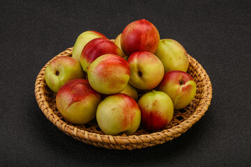 Sweet small nectarines in the basket