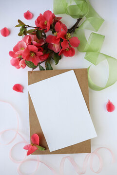 postcard mockup. small bouquet of pink flowers and space for text