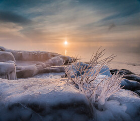 In winter the sun rose slowly over Lake Superior while the open water and -20 F degree air mixed, creating thick wisps of sea smoke. Brighton Beach, Duluth, MN.