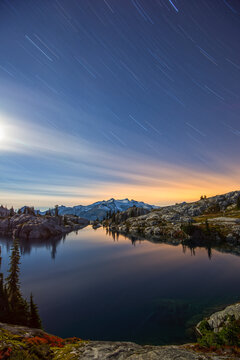 Robin Lake at sunset with Mt. Daniel and stars in the Cascade mountains of Washington.